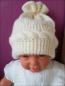 Preview: Baby Mütze, gestrickt mit Zopfmuster.